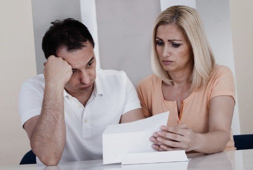 Couple looking at a shocking bill